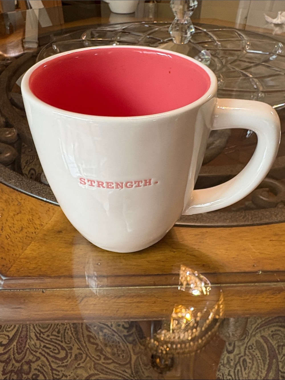 This is a Rae Dunn "STRENGTH." ceramic mug from the Artisan Collection by Magent